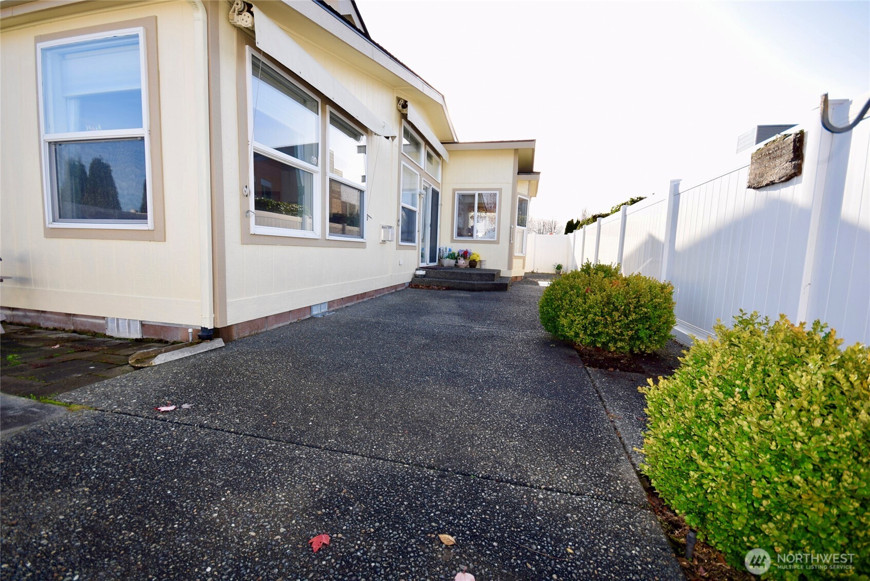 891 North Portside Way Sequim, WA 98382 - Photo 16 of 18 a backyard of a house with lots of green space