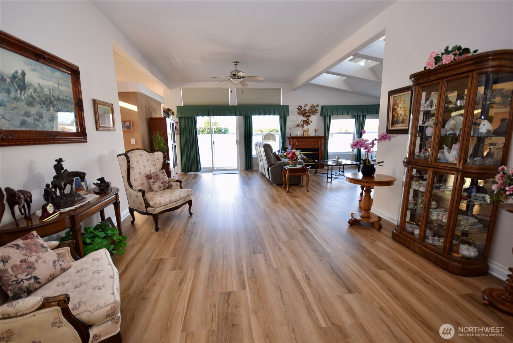 891 North Portside Way Sequim, WA 98382 - Photo 3 of 18 a living room with furniture and a wooden floor