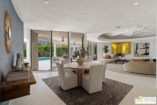 a swimming pool and dinning table and chairs