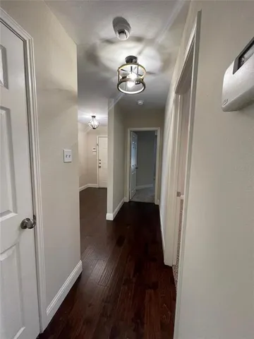 a view of hallway with windows