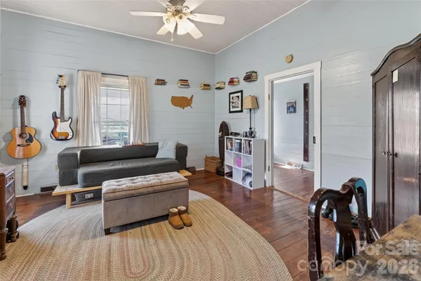a bedroom with furniture and a window