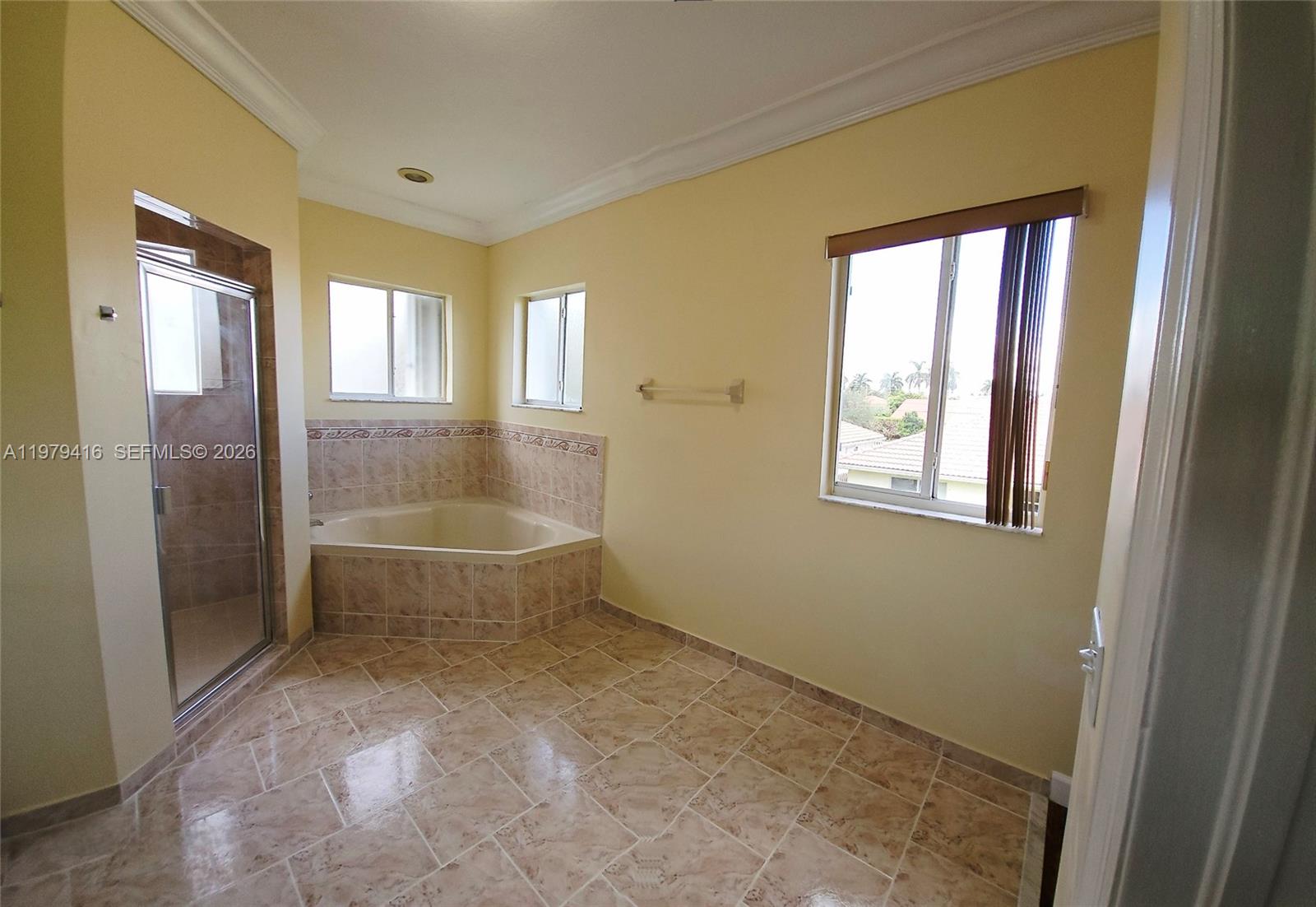 2864 Southwest 138th Path Miami, FL 33175 - Photo 14 of 19 a bathroom with a tub toilet and window