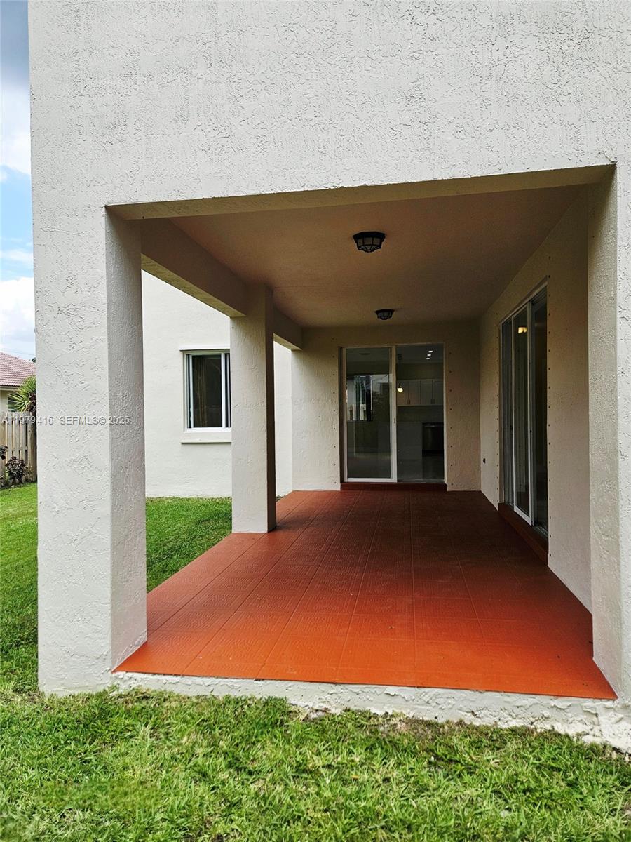 2864 Southwest 138th Path Miami, FL 33175 - Photo 16 of 19 a view of an house with backyard space and balcony
