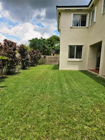 a view of house in front of yard