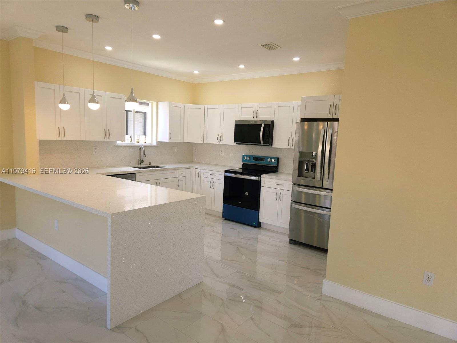 2864 Southwest 138th Path Miami, FL 33175 - Photo 8 of 19 a large white kitchen with cabinets