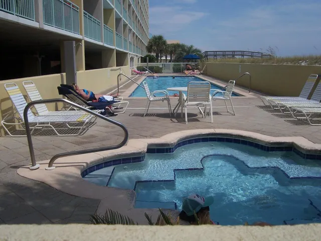 a view of a swimming pool with a patio