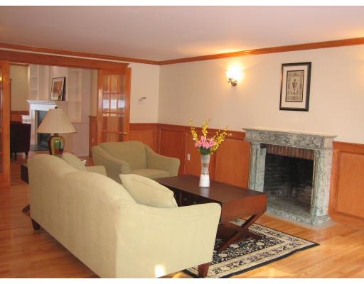 5 Longfellow Road Wellesley, MA 02481 - Photo 5 of 23 a living room with furniture and a fireplace