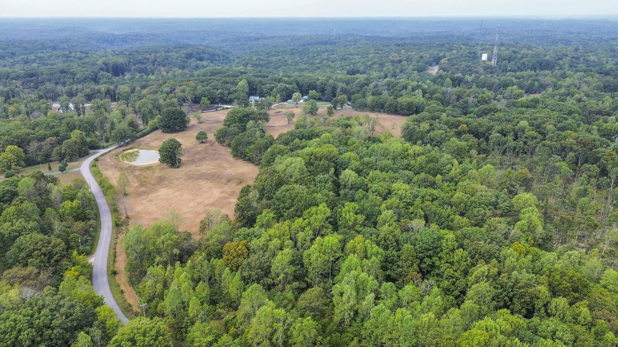 1165 Mt Pleasant Road Kingston Springs, TN 37082 - Photo 4 of 7 an aerial view of a house with a yard and lake view