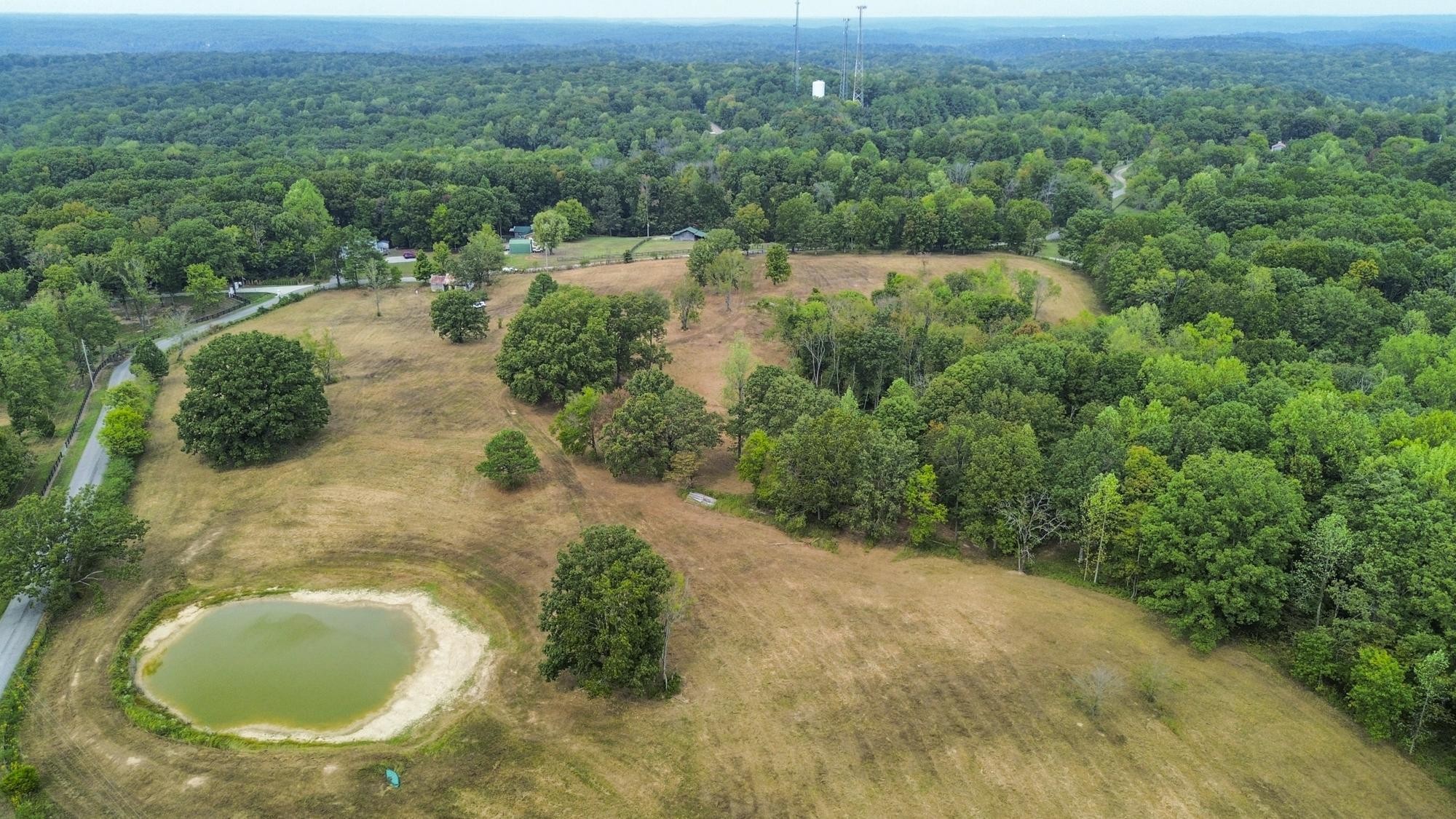 1165 Mt Pleasant Road Kingston Springs, TN 37082 - Photo 7 of 7 an aerial view of residential house with outdoor space and trees all around