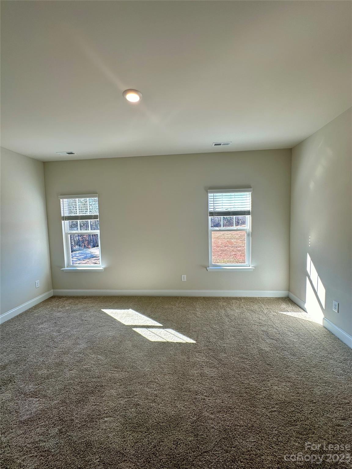 9519 Pointer Road Huntersville, NC 28078 - Photo 17 of 34 an empty room with windows