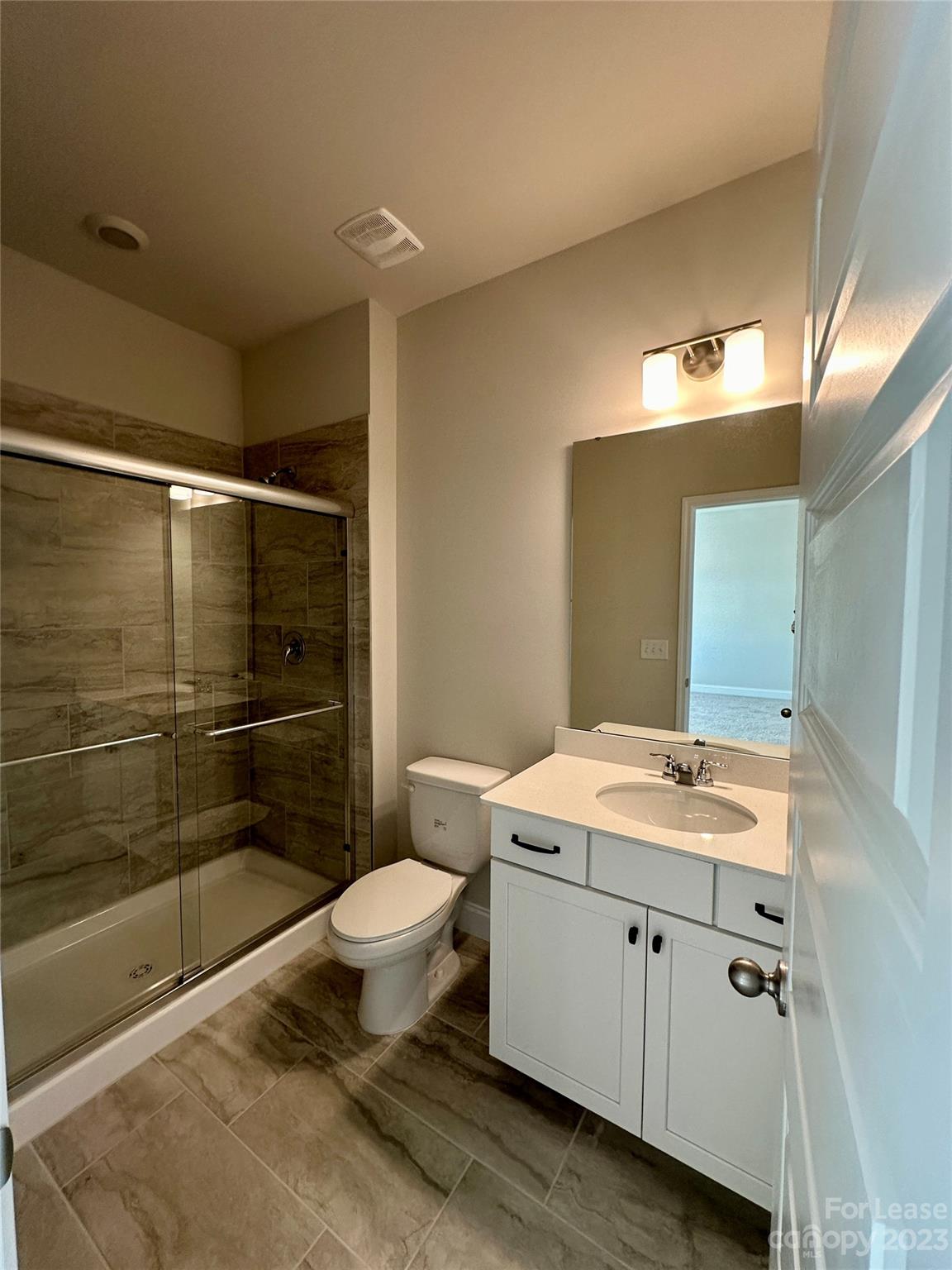 9519 Pointer Road Huntersville, NC 28078 - Photo 18 of 34 a bathroom with a sink toilet and shower