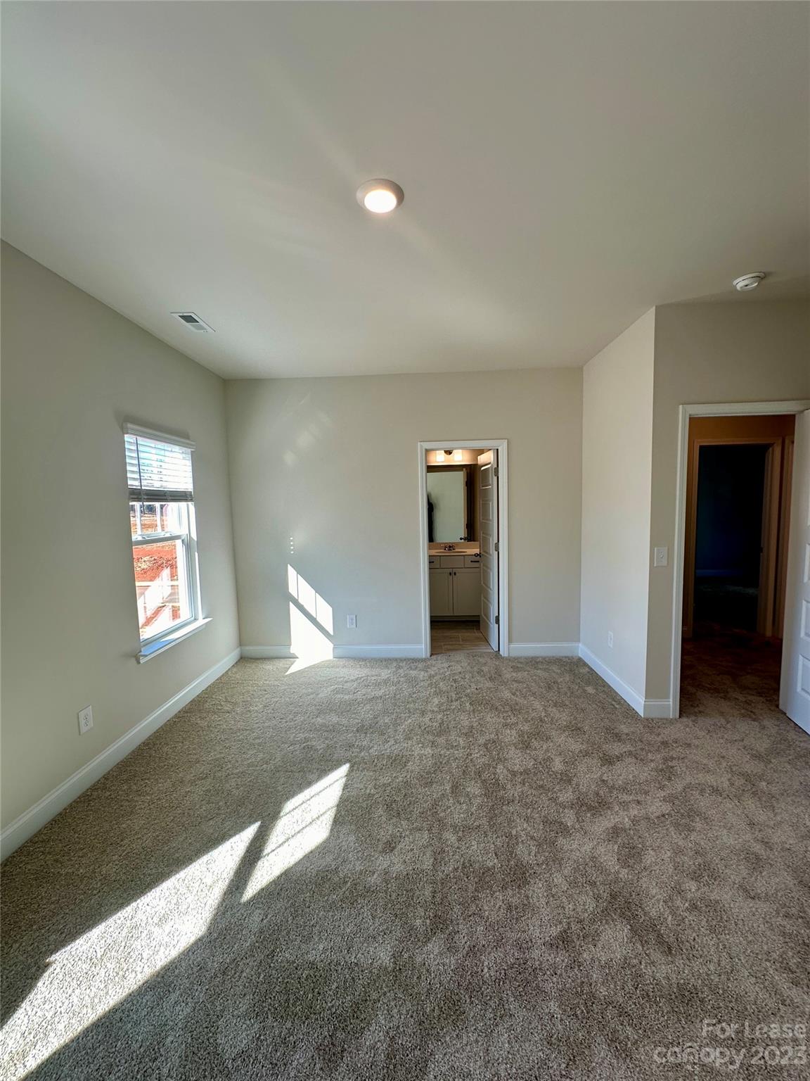 9519 Pointer Road Huntersville, NC 28078 - Photo 19 of 34 a view of an empty room with a window