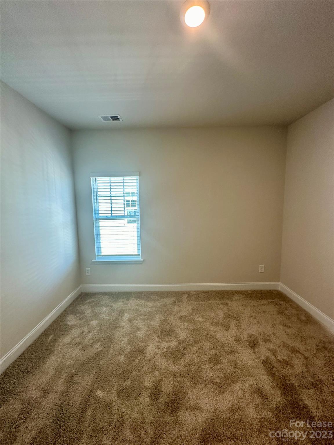 9519 Pointer Road Huntersville, NC 28078 - Photo 21 of 34 an empty room with a window