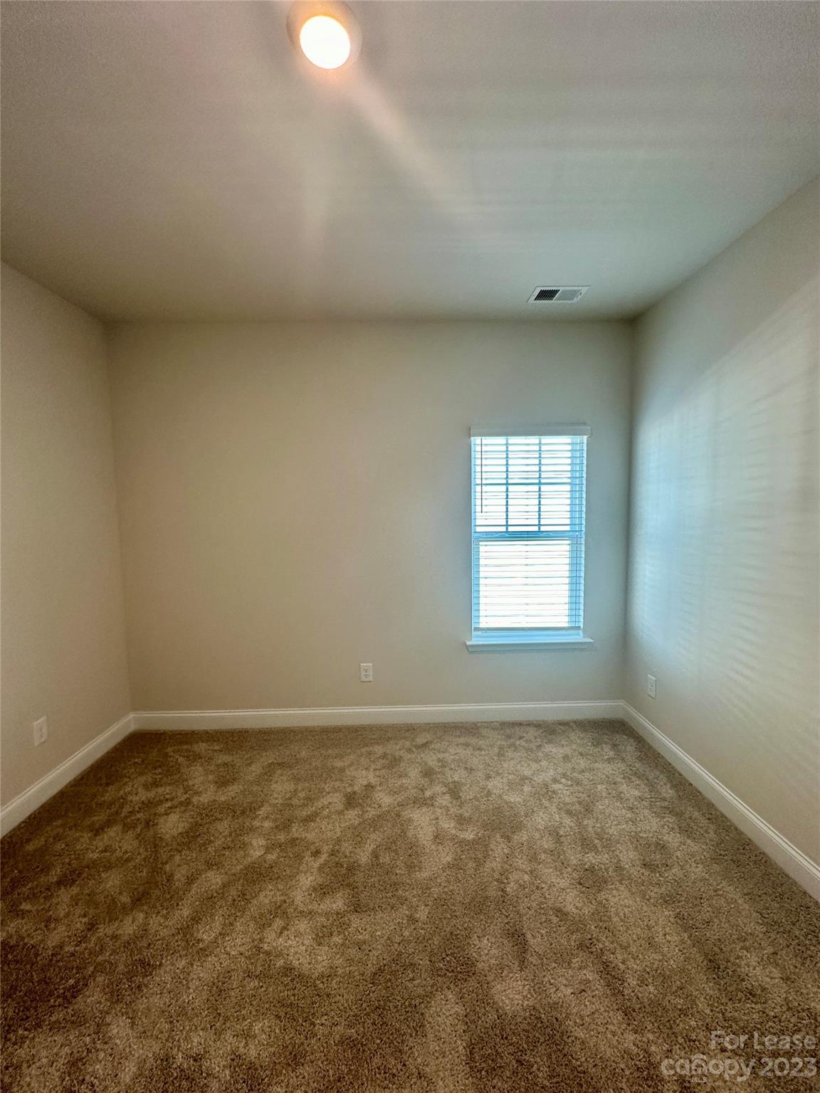 9519 Pointer Road Huntersville, NC 28078 - Photo 23 of 34 an empty room with a window