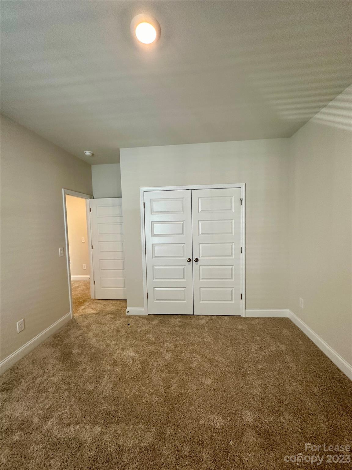 9519 Pointer Road Huntersville, NC 28078 - Photo 25 of 34 an empty room with natural light