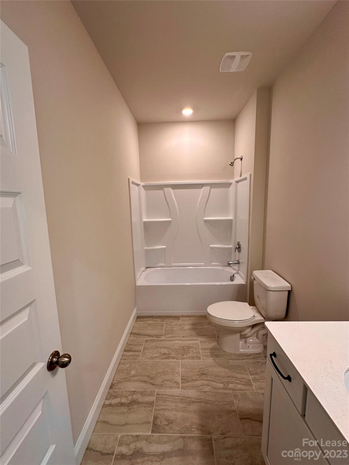 9519 Pointer Road Huntersville, NC 28078 - Photo 26 of 34 a bathroom with a granite countertop sink toilet and shower