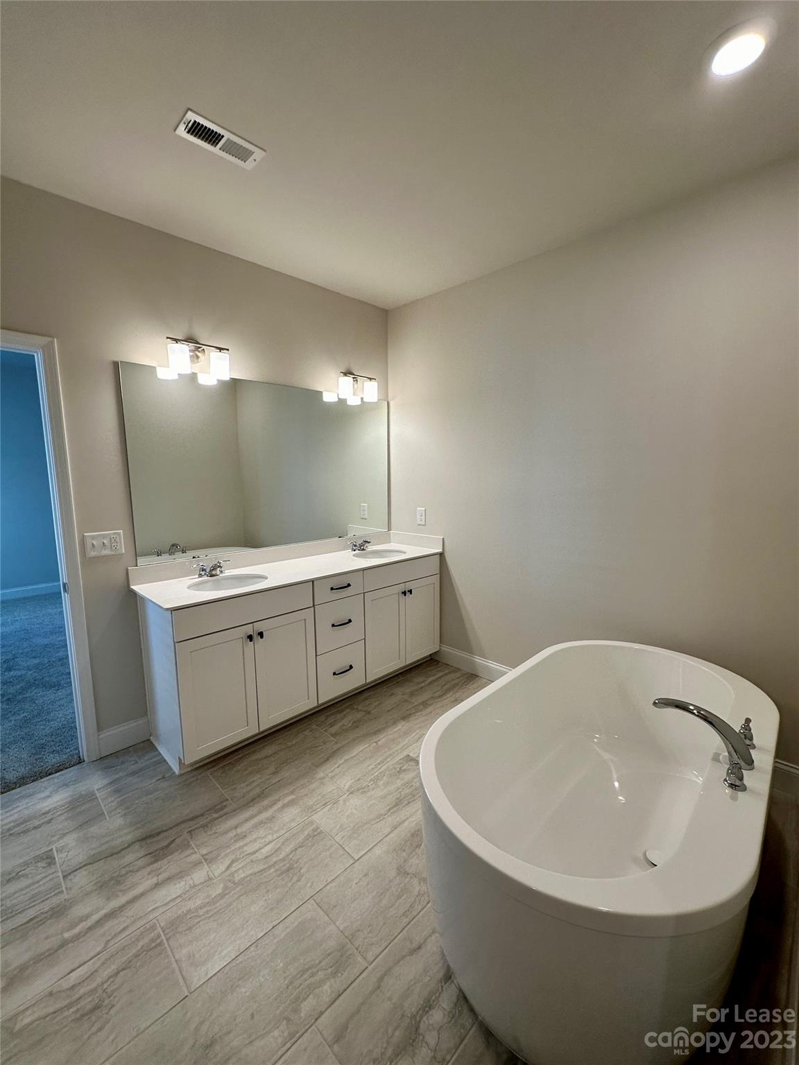 9519 Pointer Road Huntersville, NC 28078 - Photo 30 of 34 a view of a room with wooden floor and white walls