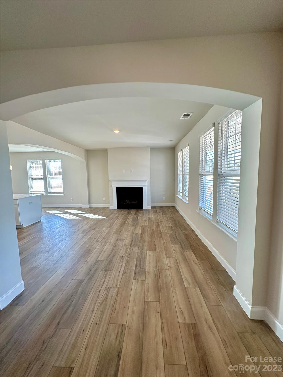 9519 Pointer Road Huntersville, NC 28078 - Photo 3 of 34 a view of empty room with wooden floor and fan