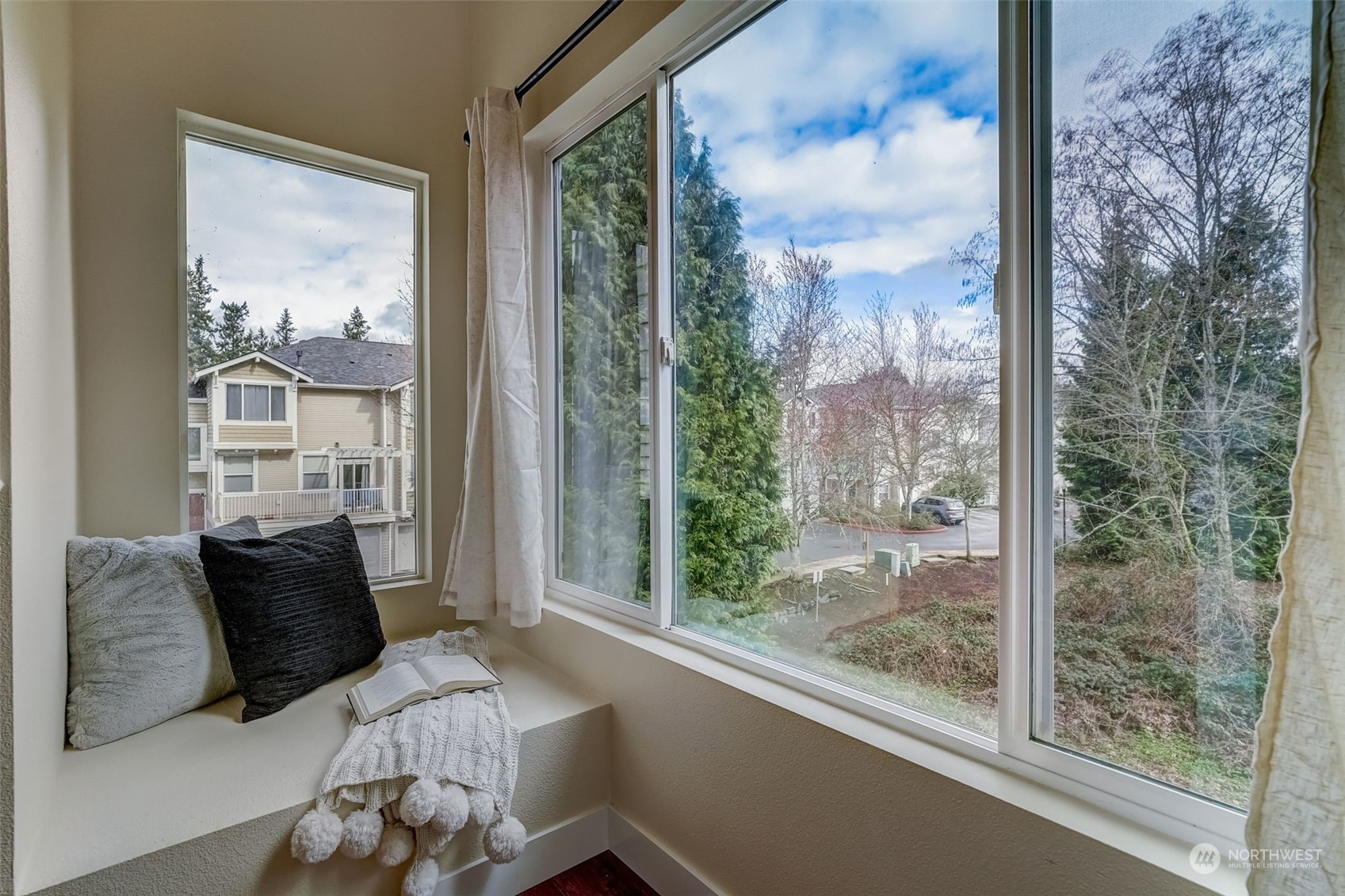 11873 Northeast 162nd Lane, Unit 121 Bothell, WA 98011 - Photo 12 of 32 a living room with furniture and a floor to ceiling window