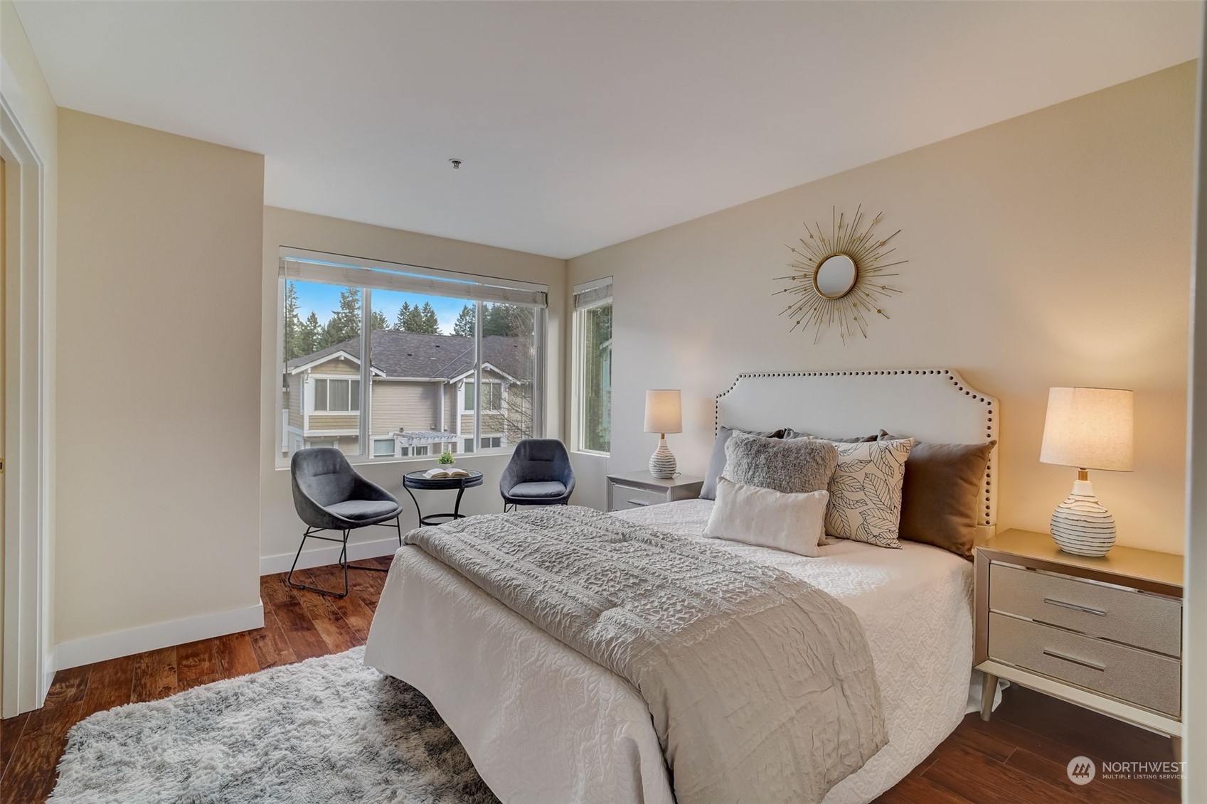 11873 Northeast 162nd Lane, Unit 121 Bothell, WA 98011 - Photo 15 of 32 a bedroom with bed and wooden floor