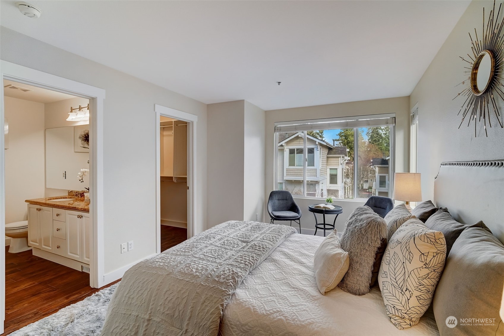 11873 Northeast 162nd Lane, Unit 121 Bothell, WA 98011 - Photo 16 of 32 a bed room with a bed and a large window