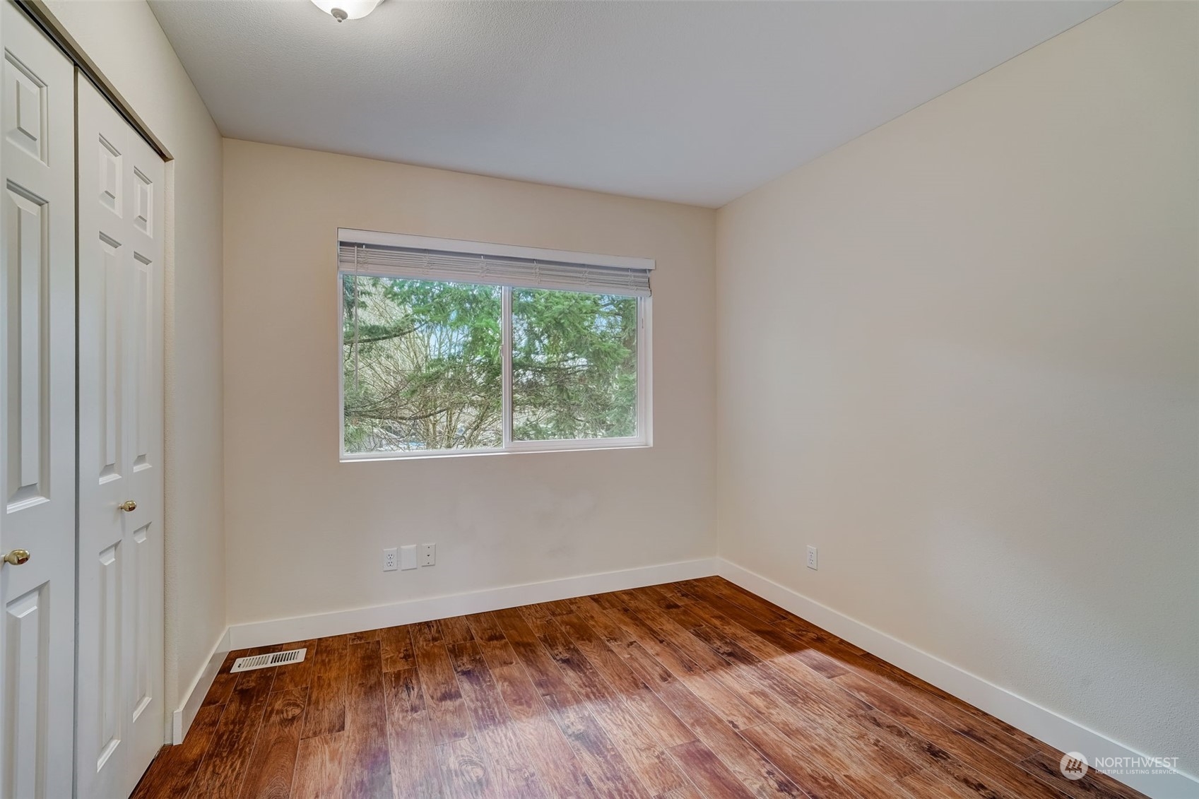 11873 Northeast 162nd Lane, Unit 121 Bothell, WA 98011 - Photo 21 of 32 a view of empty room with wooden floor and fan