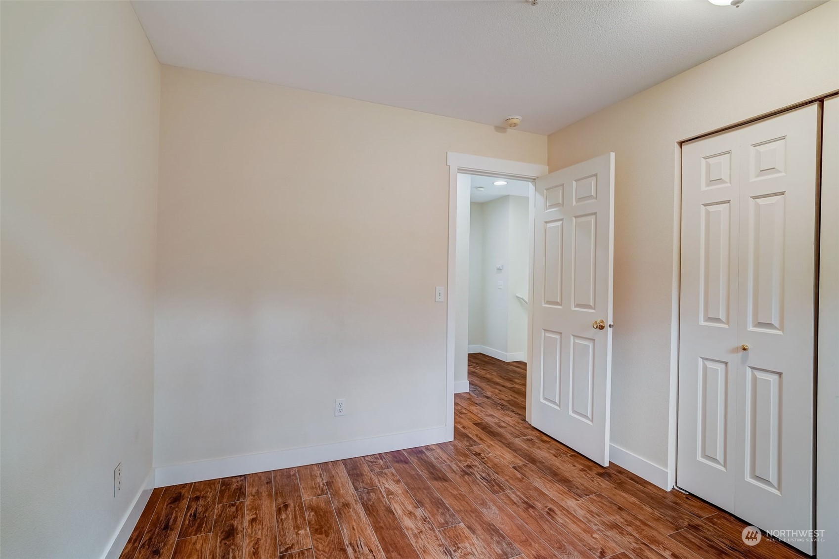 11873 Northeast 162nd Lane, Unit 121 Bothell, WA 98011 - Photo 22 of 32 a view of a room with wooden floor and closet