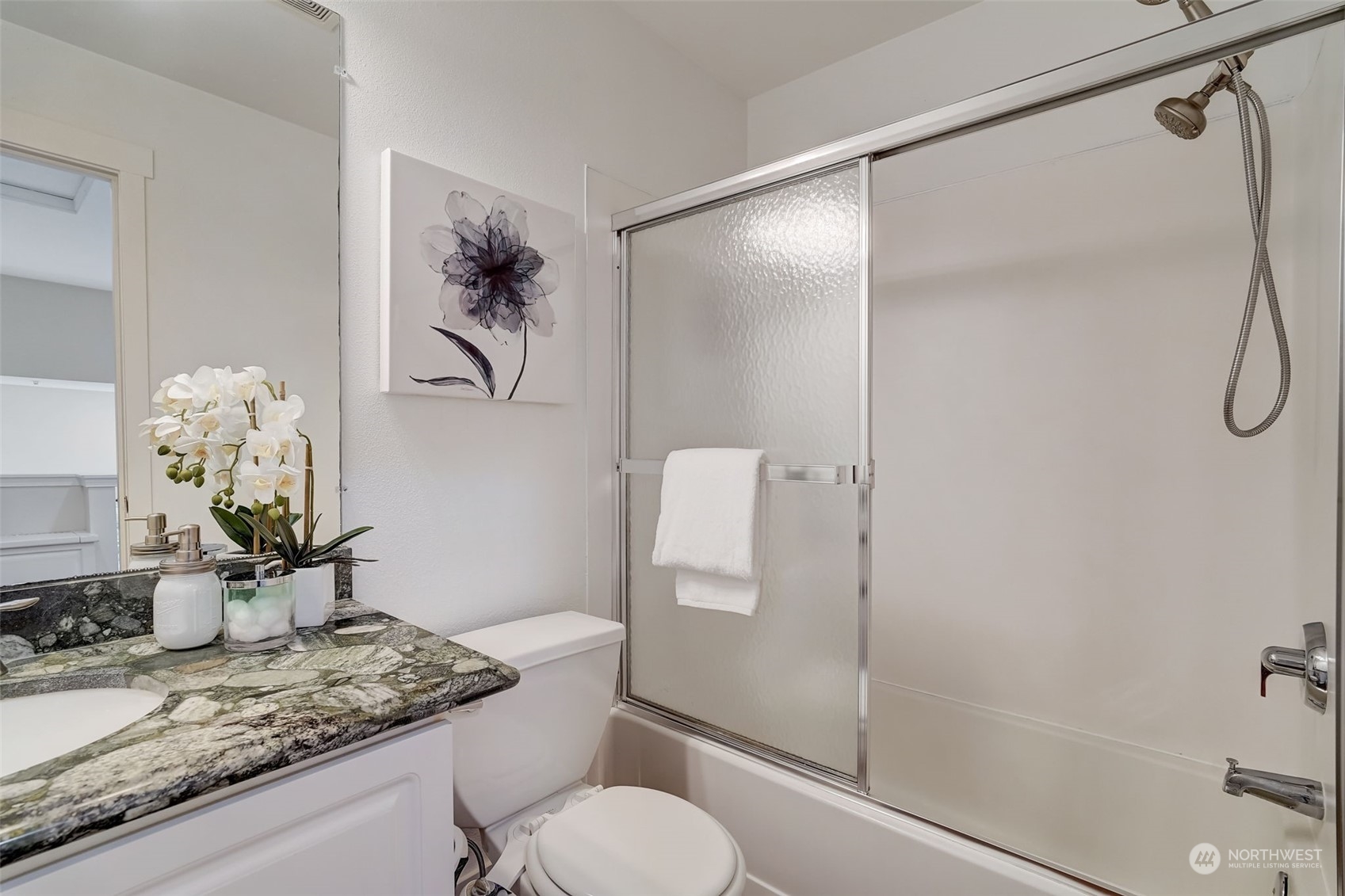 11873 Northeast 162nd Lane, Unit 121 Bothell, WA 98011 - Photo 23 of 32 a bathroom with a granite countertop sink toilet and shower