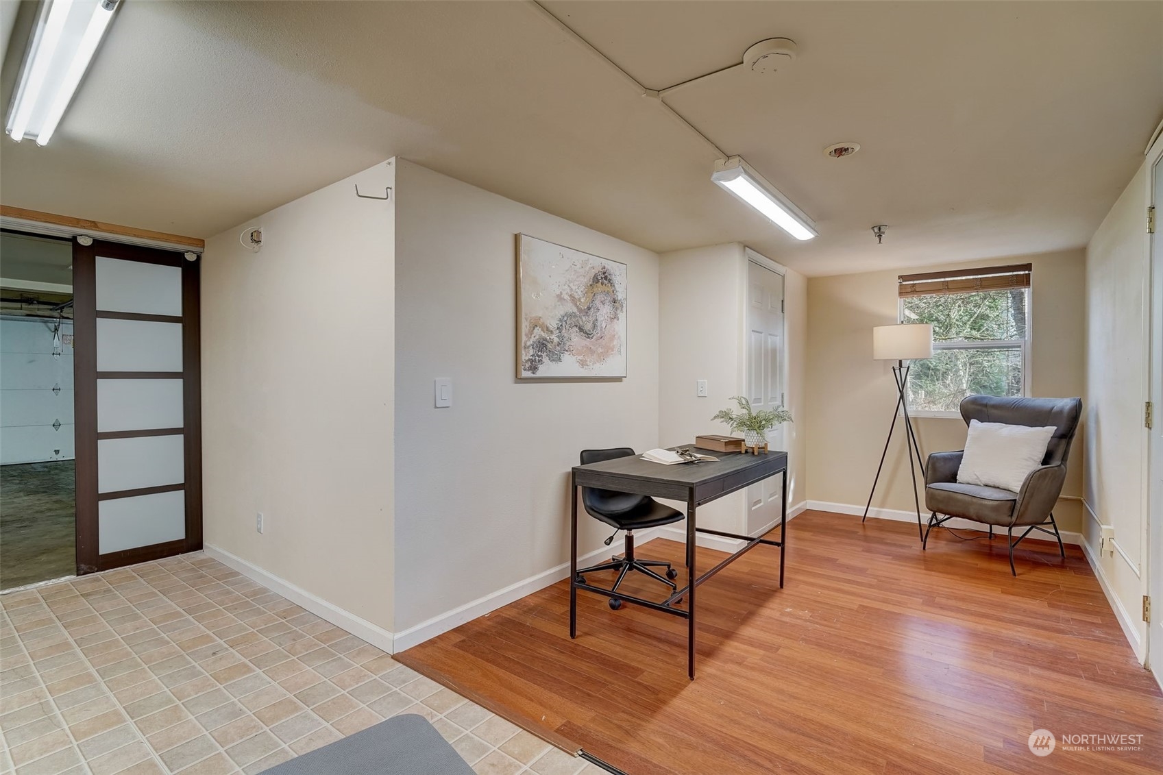11873 Northeast 162nd Lane, Unit 121 Bothell, WA 98011 - Photo 26 of 32 a workspace with furniture and wooden floor