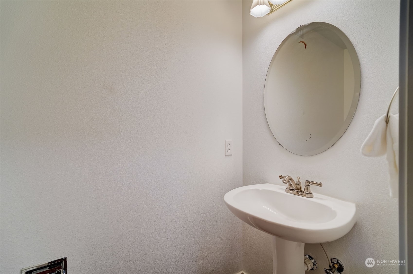 11873 Northeast 162nd Lane, Unit 121 Bothell, WA 98011 - Photo 27 of 32 a bathroom with a sink a mirror and a toilet
