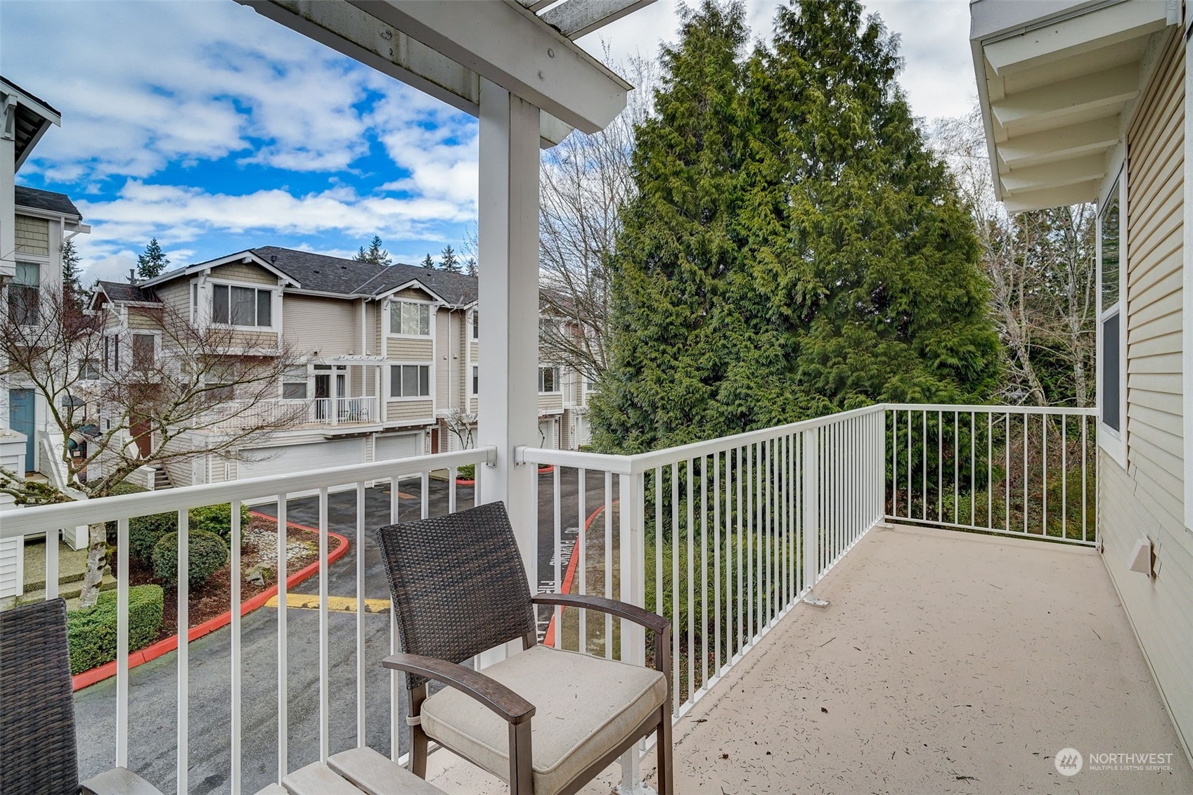 11873 Northeast 162nd Lane, Unit 121 Bothell, WA 98011 - Photo 28 of 32 a view of a chair and table in the balcony