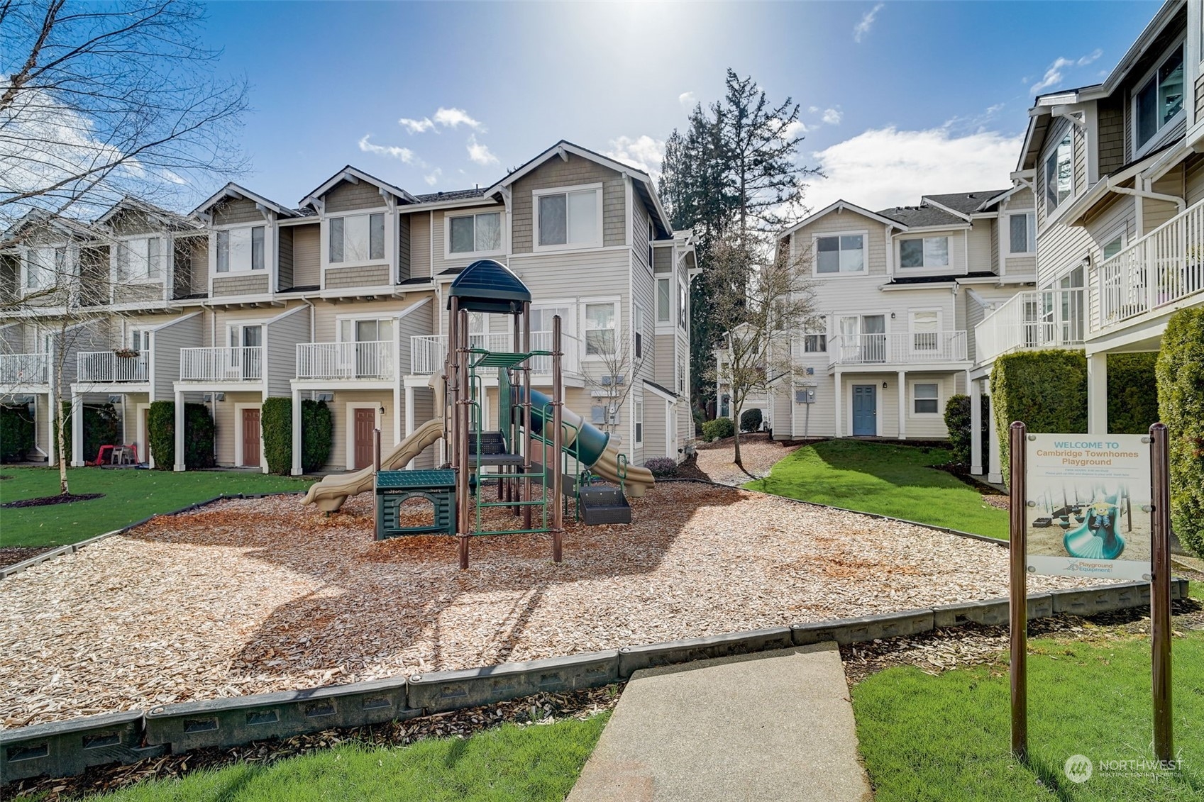 11873 Northeast 162nd Lane, Unit 121 Bothell, WA 98011 - Photo 30 of 32 a front view of a house with garden