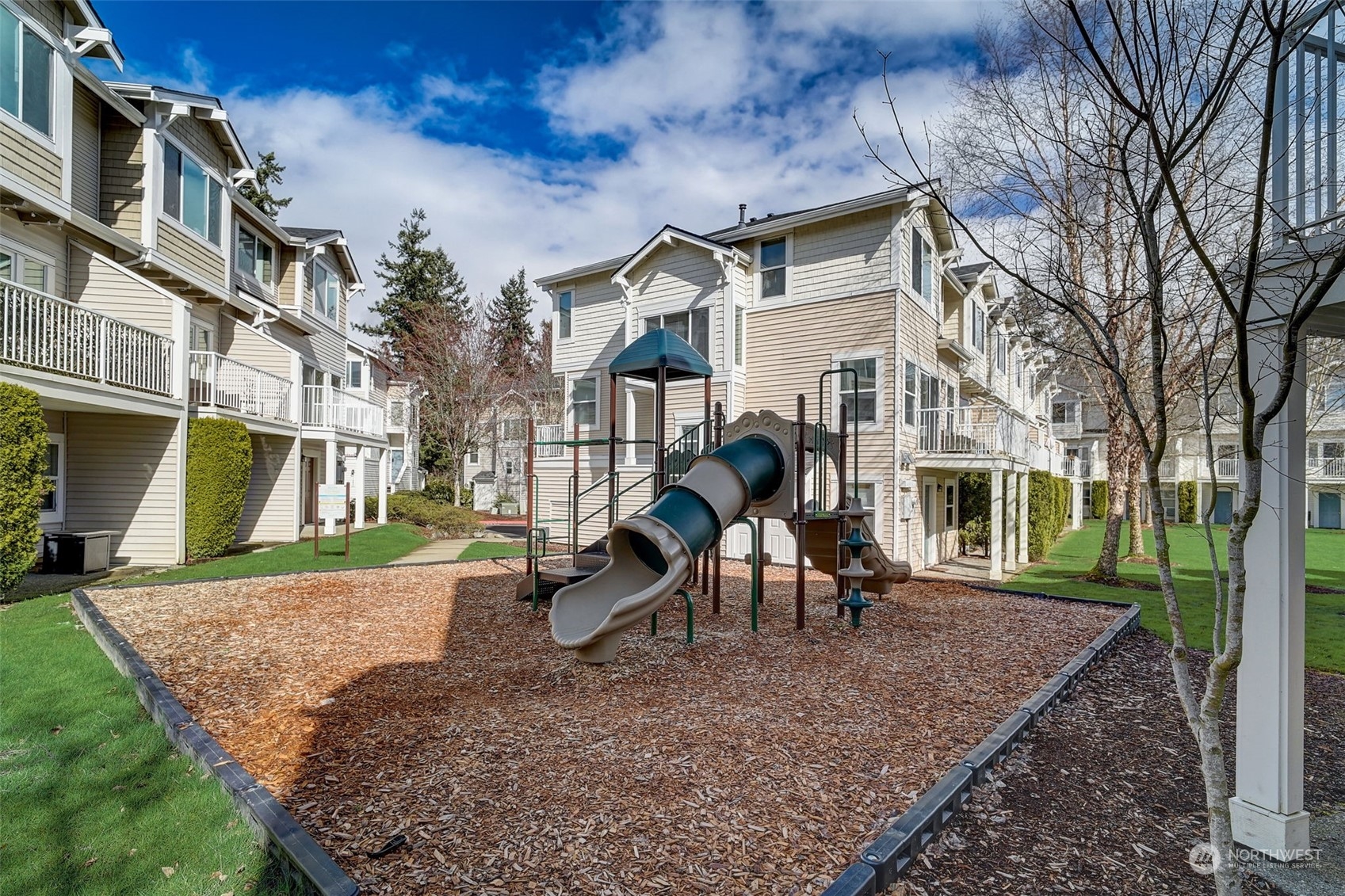 11873 Northeast 162nd Lane, Unit 121 Bothell, WA 98011 - Photo 31 of 32 a front view of a house with a yard
