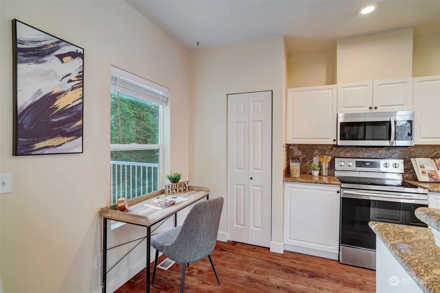 11873 Northeast 162nd Lane, Unit 121 Bothell, WA 98011 - Photo 8 of 32 a kitchen with stainless steel appliances a stove a sink and a refrigerator