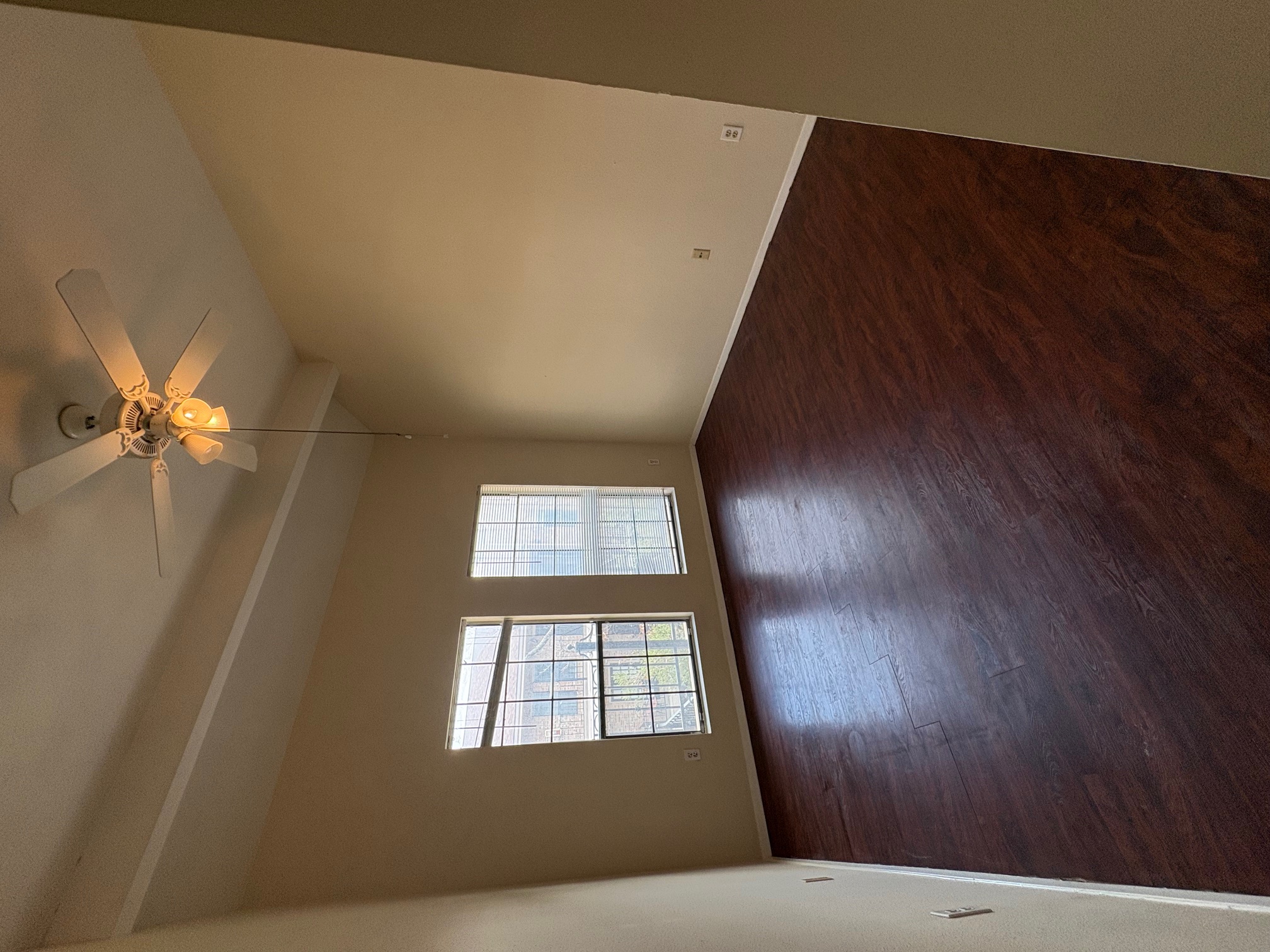 2801 Rio Grande Street, Unit 303 Austin, TX 78705 - Photo 8 of 11 Unfurnished room with ceiling fan and dark wood finished floors