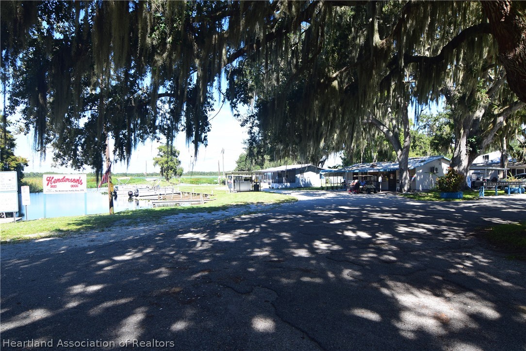 14 Henderson Road Lake Placid, FL 33852 - Photo 25 of 28 a view of a street with houses on side of street