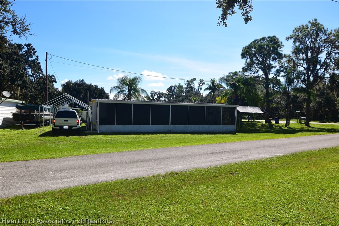 14 Henderson Road Lake Placid, FL 33852 - Photo 7 of 28 a house view with swimming pool in front of it