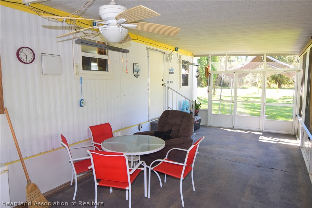 14 Henderson Road Lake Placid, FL 33852 - Photo 9 of 28 a view of a dining room with furniture and a window