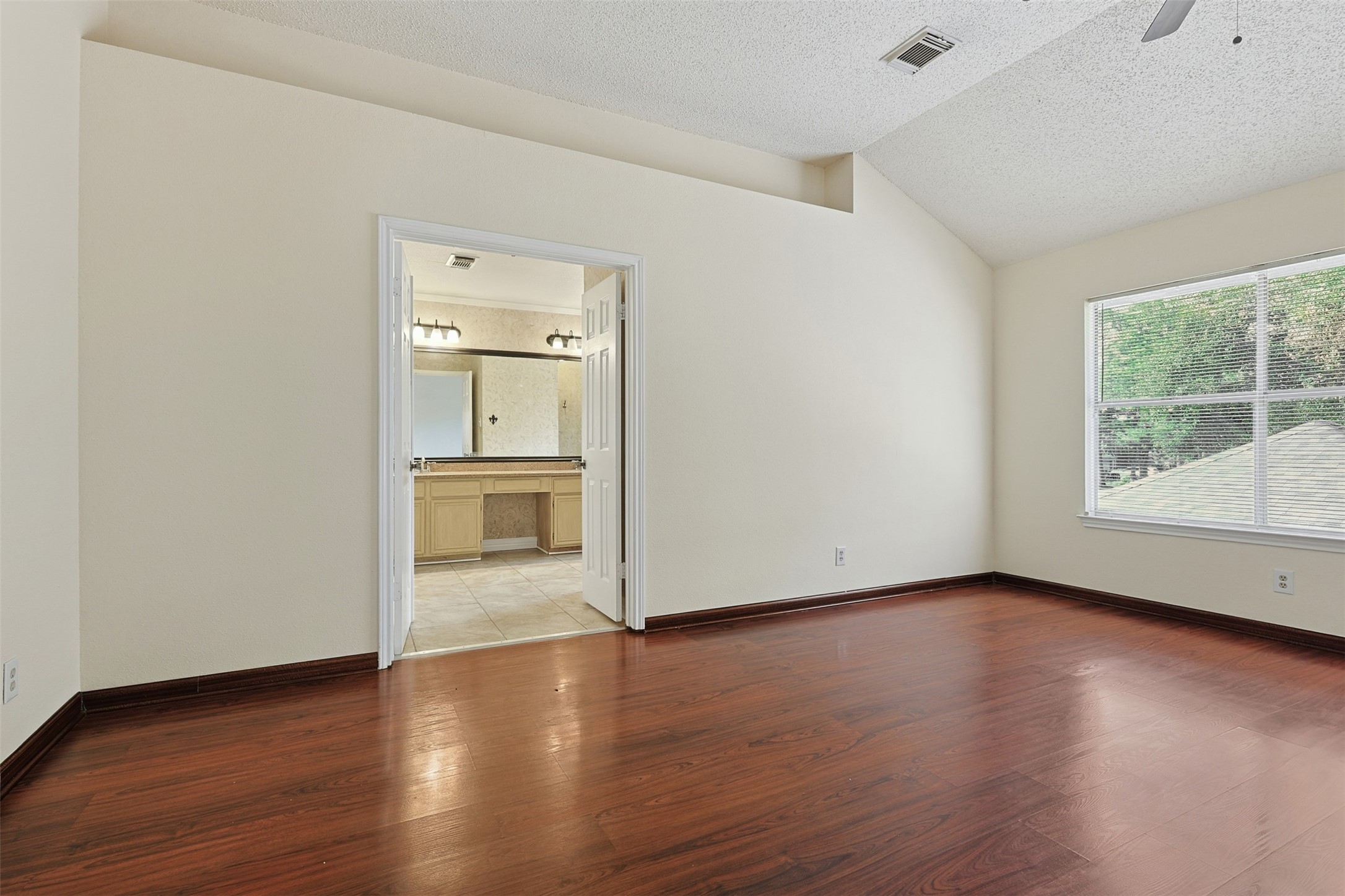 9414 Calwood Circle Spring, TX 77379 - Photo 14 of 17 wooden floor in an empty room with a window