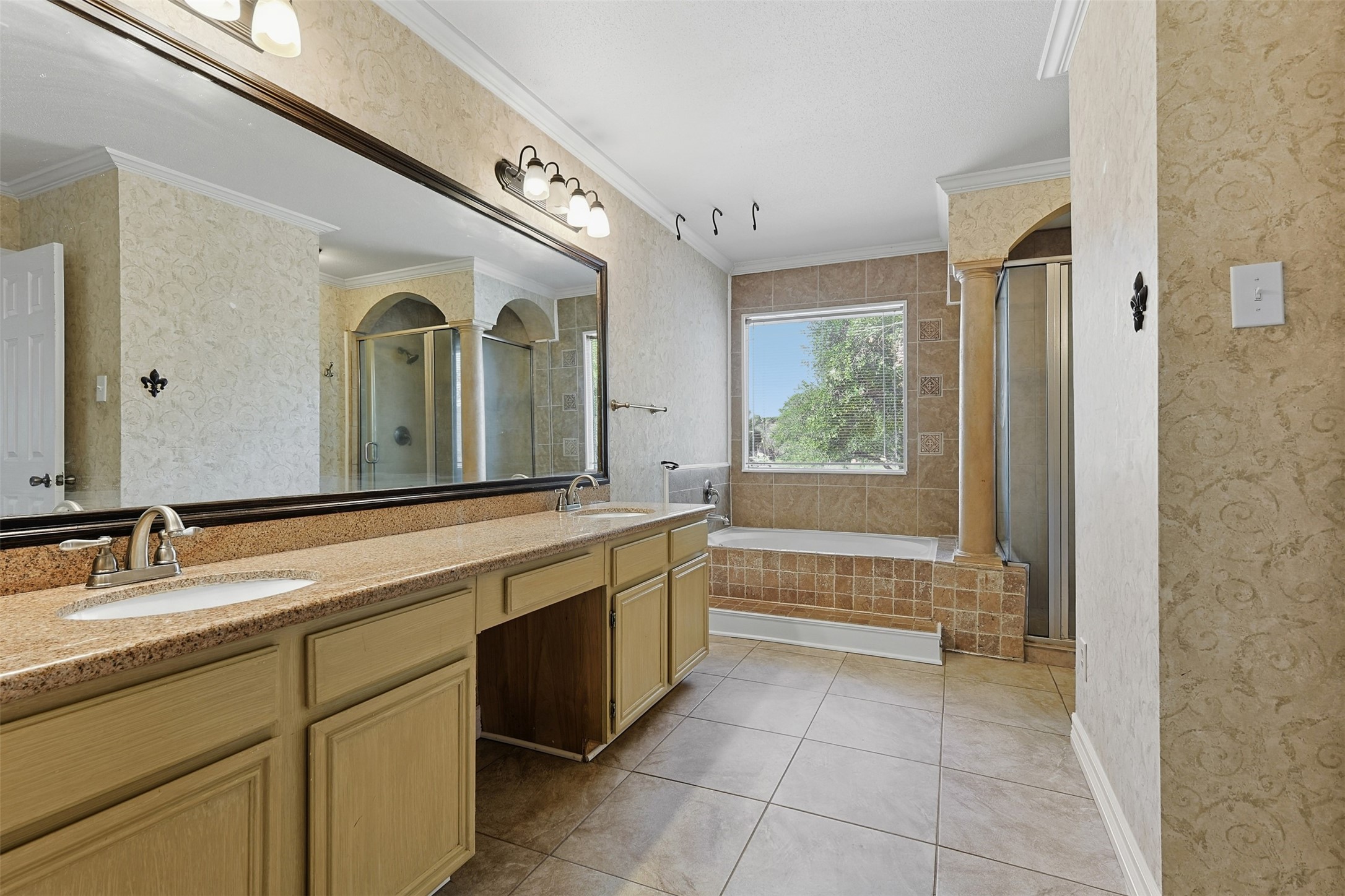 9414 Calwood Circle Spring, TX 77379 - Photo 16 of 17 a large bathroom with a large tub sink and mirror
