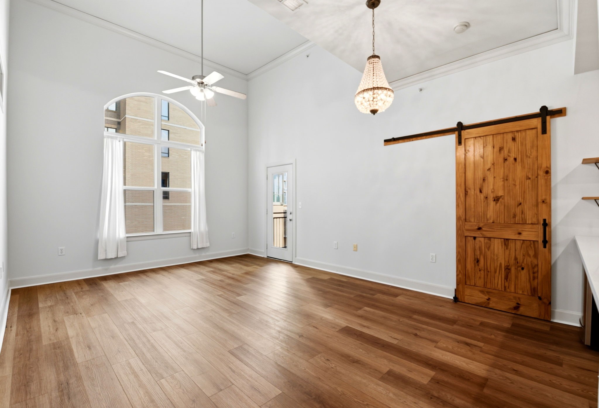 1010 Rosine Street, Unit 43 Houston, TX 77019 - Photo 18 of 48 a view of a room with wooden floor staircase and a ceiling fan