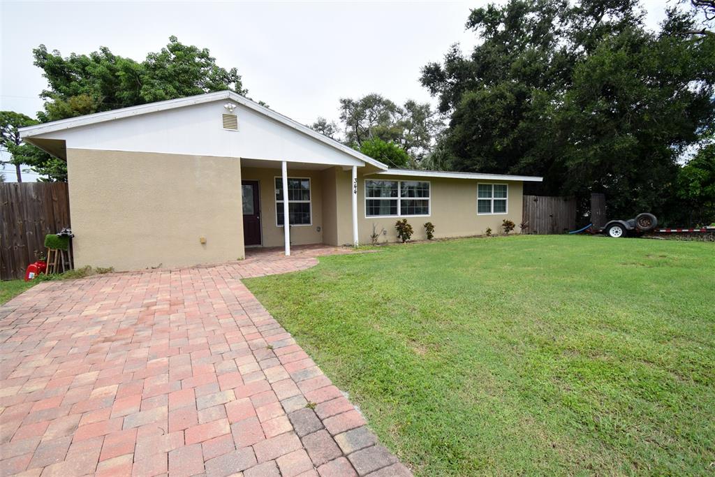 a front view of a house with yard