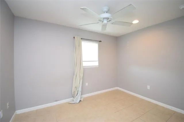 a bathroom with a toilet a sink and a mirror