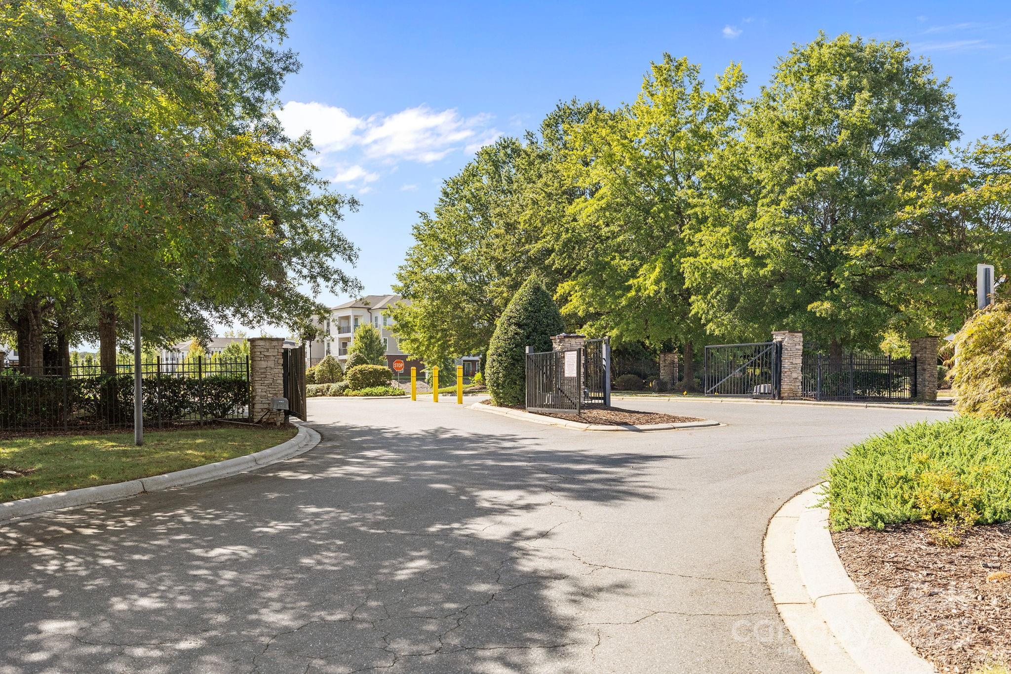7443 Red Mulberry Way Charlotte, NC 28273 - Photo 14 of 45 a front view of a house with a yard and a garage