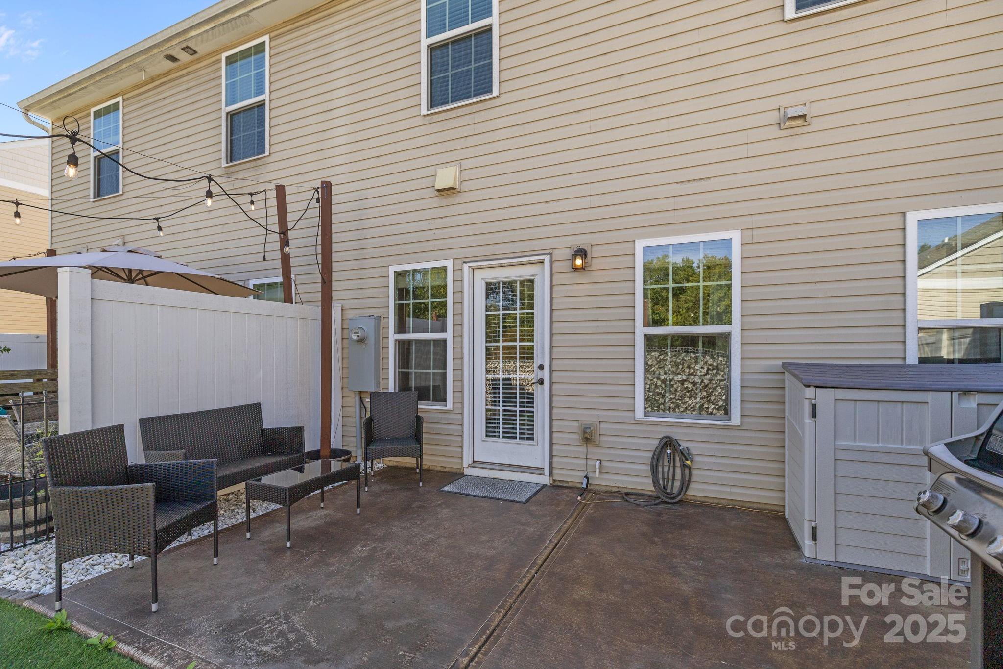 7443 Red Mulberry Way Charlotte, NC 28273 - Photo 17 of 45 a backyard of a house with seating space