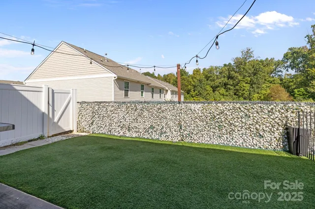 a view of a house with a yard and a garden