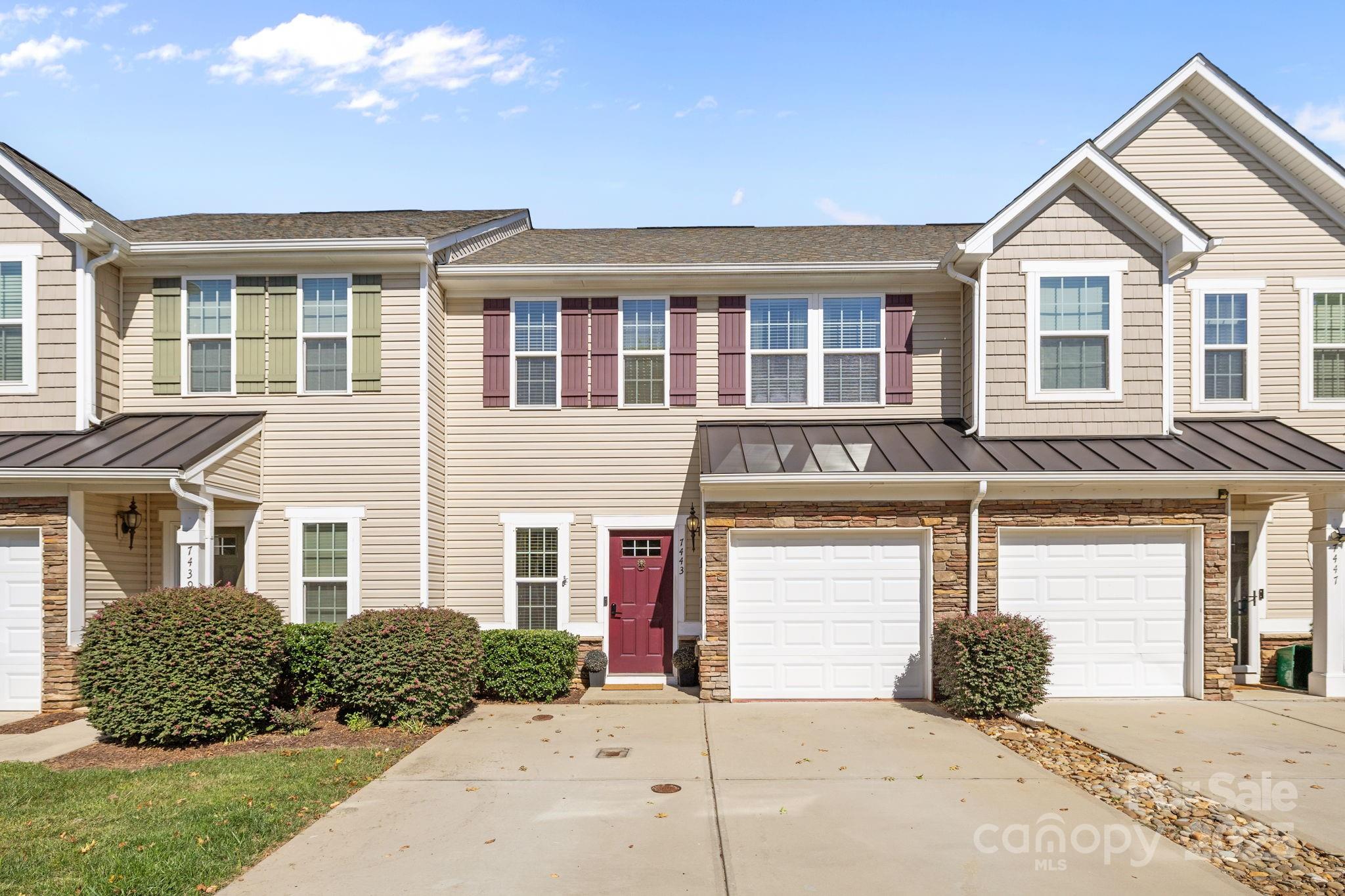 7443 Red Mulberry Way Charlotte, NC 28273 - Photo 2 of 45 a front view of a house with garden