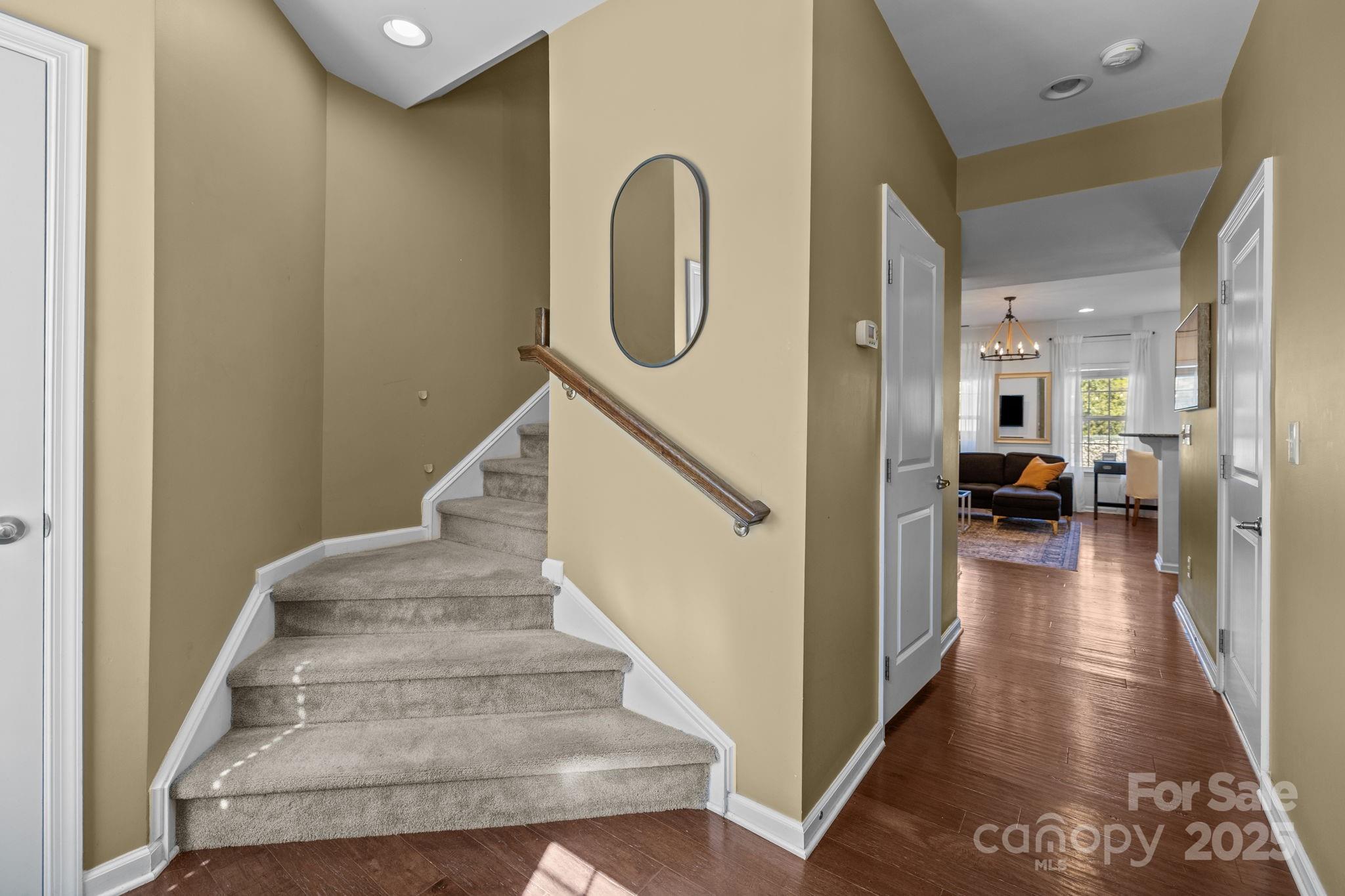 7443 Red Mulberry Way Charlotte, NC 28273 - Photo 23 of 45 a view of entryway and hall with wooden floor