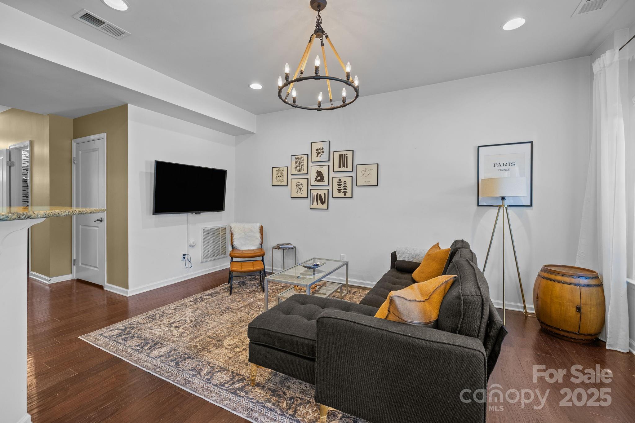 7443 Red Mulberry Way Charlotte, NC 28273 - Photo 31 of 45 a living room with furniture and a flat screen tv