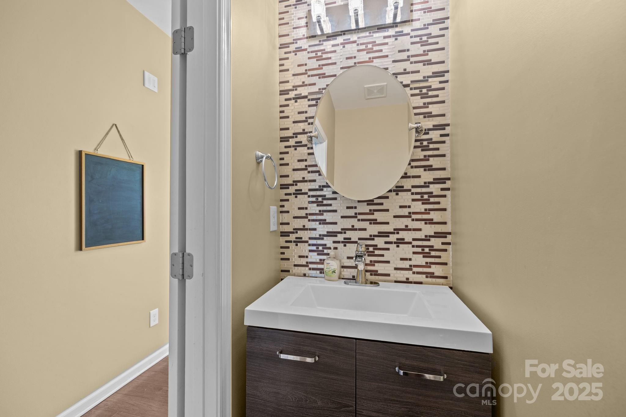 7443 Red Mulberry Way Charlotte, NC 28273 - Photo 34 of 45 a bathroom with a sink and a mirror